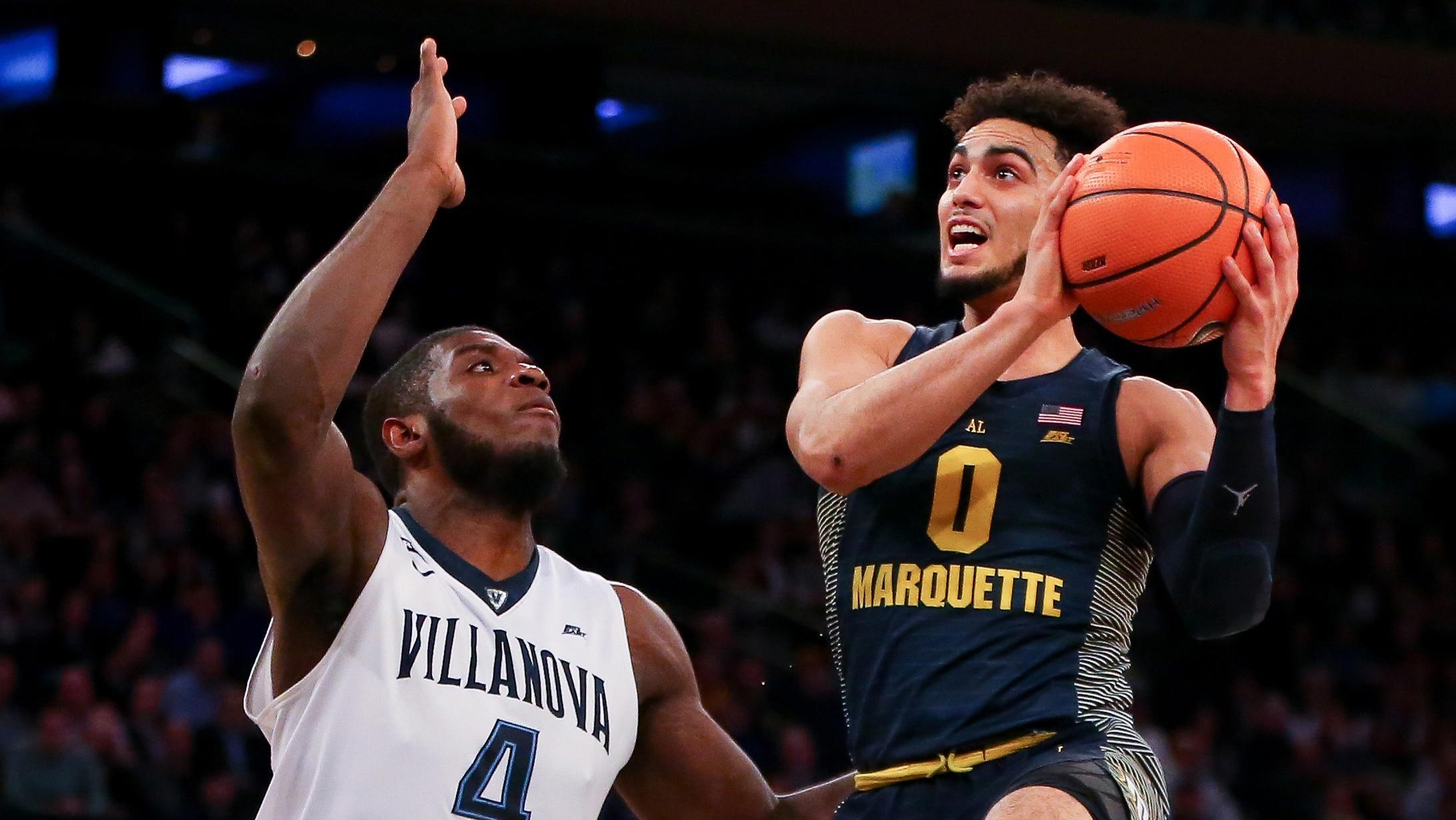 Marquette guard Markus Howard drives to the rim