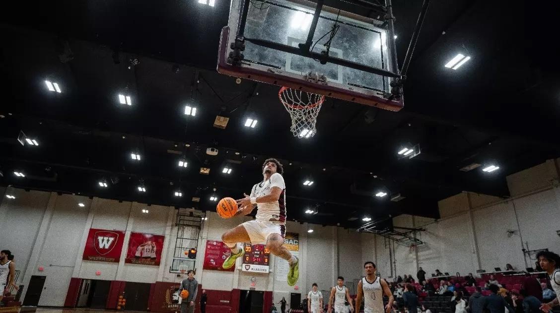 Adrian McIntyre goes in for a dunk.