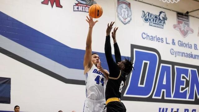 Benjamin Bill fights at the basket for undefeated Daemen. 