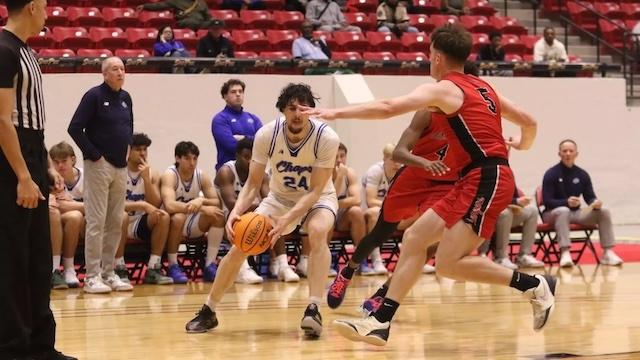 Antonio Pusateri drives to the basket for Lubbock Christian basketball.